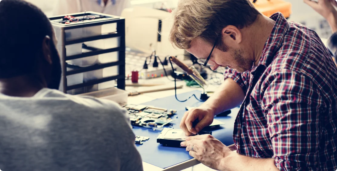 two-hands-with-screwdriver-disassemble-hdd